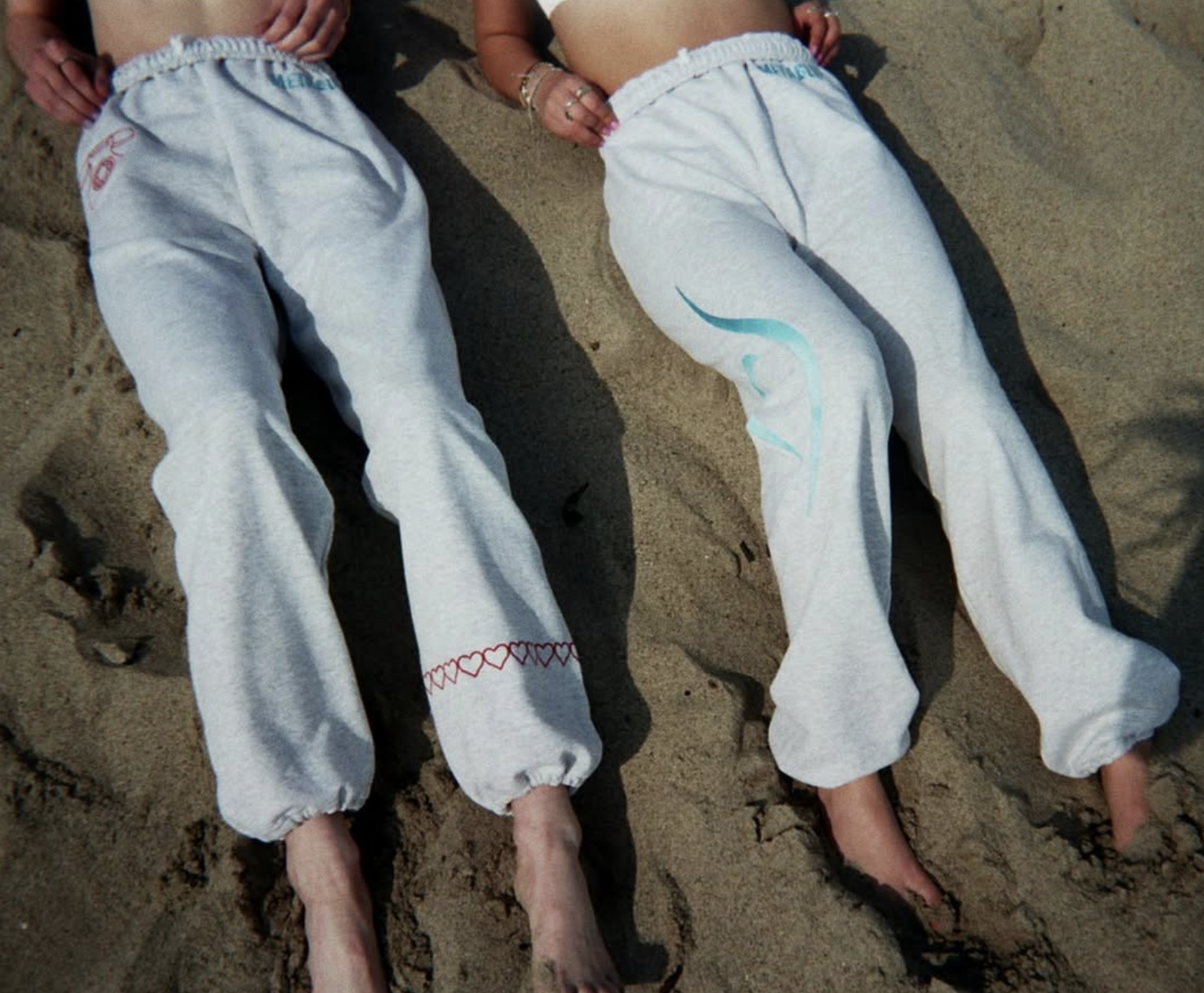 Metablue custom embroidered sweatpants on the beach
