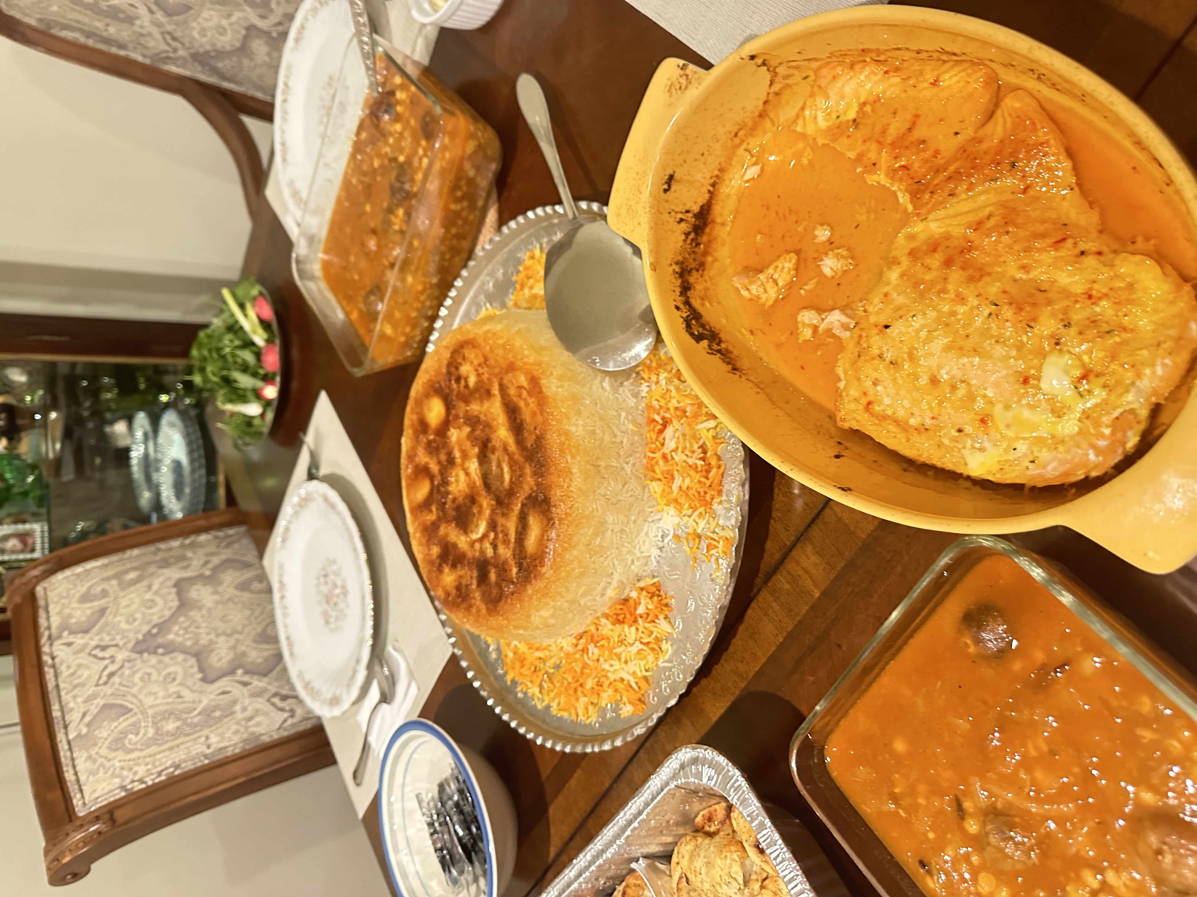 Persian saffron rice with zereshk and stew on a holiday table
