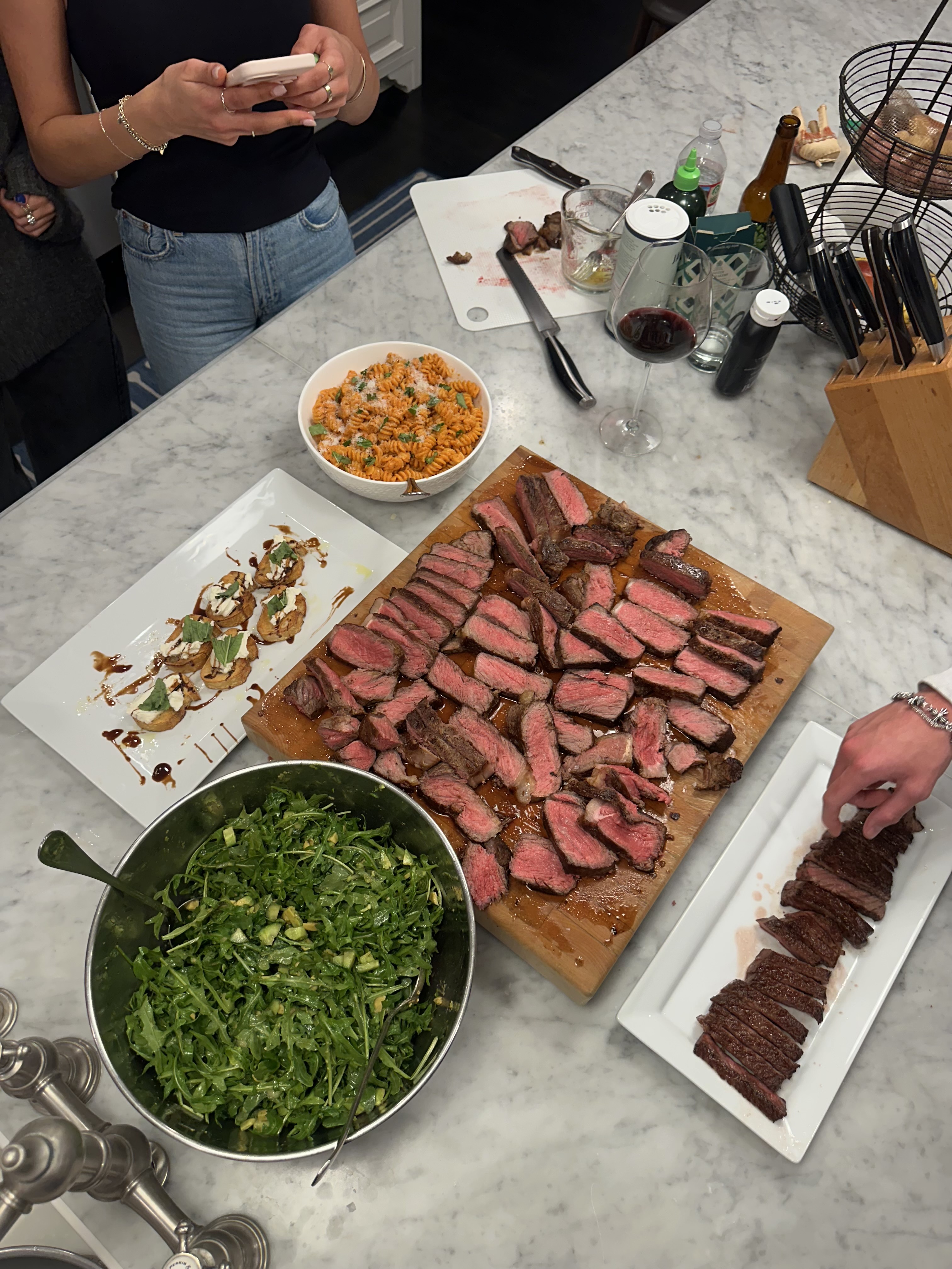 Sliced ribeye with arugula salad and sweet potato